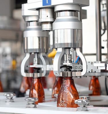 ガラス/プラスチックびんねじふた締め機機械